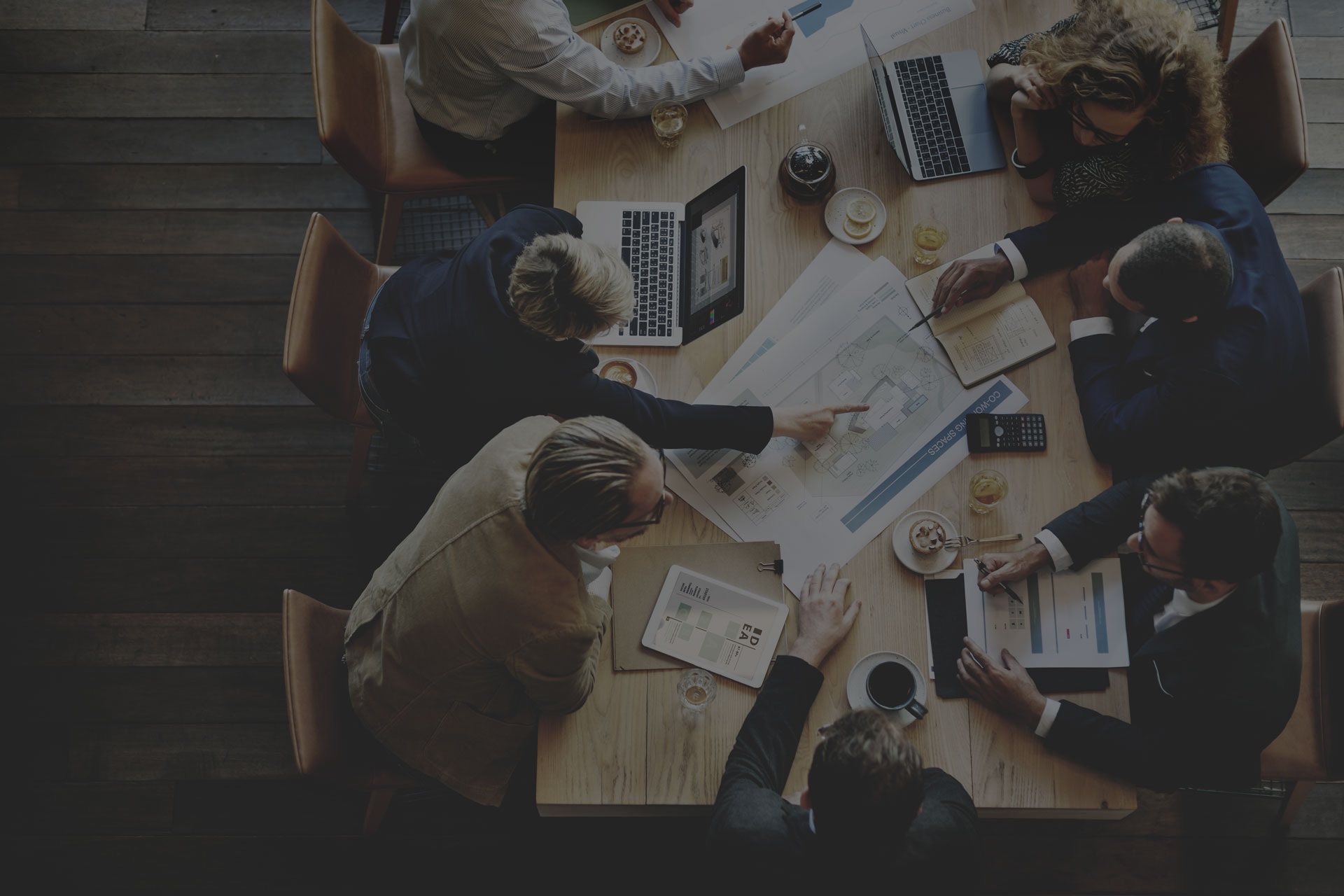 overhead shot of office works collaborating together on a project