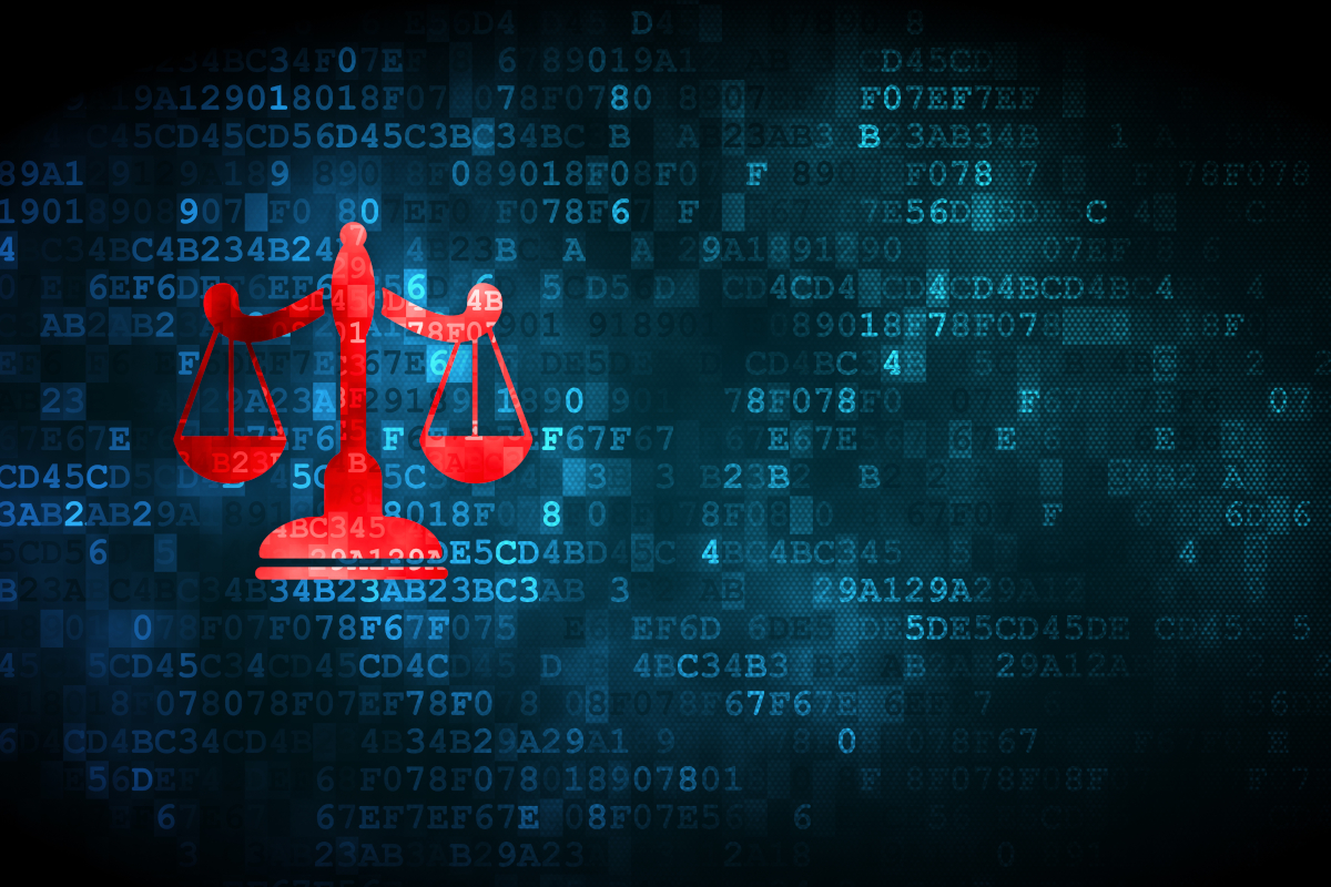 Scales of justice overlaid on blue binary code.